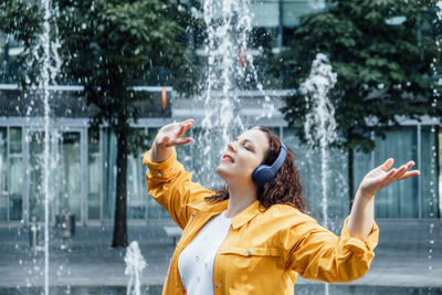 Outdoor portrait of woman in headset in sound healing therapy. healing sounds and sound therapy