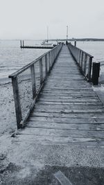 Pier over sea against sky