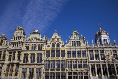 Low angle view of historical building against blue sky