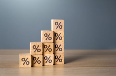 Close-up of toy blocks on table against gray background