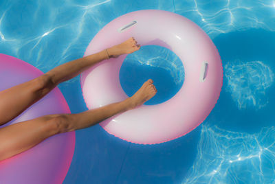 Low section of woman in swimming pool