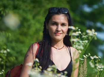 Portrait of beautiful young woman standing outdoors