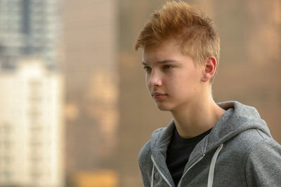 Portrait of boy looking away outdoors