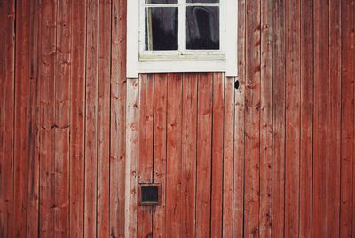 Full frame shot of window on wooden door