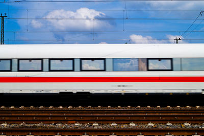 Train moving on railroad track against sky