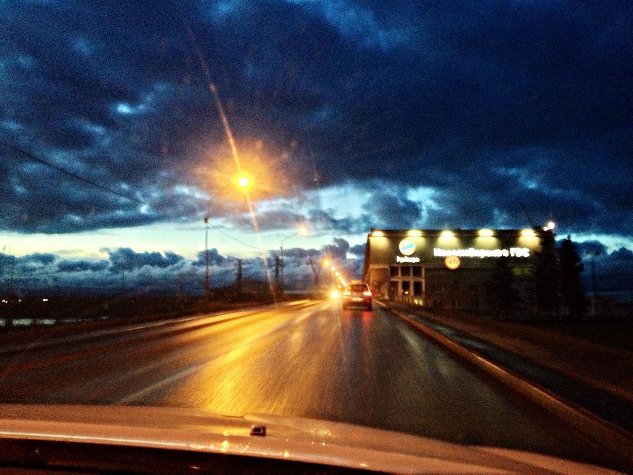 transportation, road, sky, illuminated, the way forward, cloud - sky, road marking, night, long exposure, on the move, diminishing perspective, highway, light trail, motion, mode of transport, car, land vehicle, speed, cloudy, travel