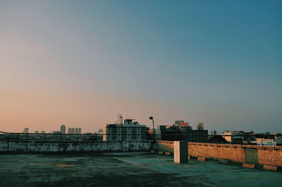 Exterior of buildings in city against clear sky