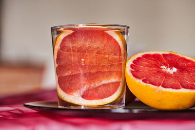 Close-up of orange juice on table