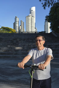 Portrait of young man riding bicycle