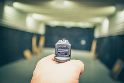 Close-up of person holding gun