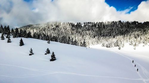 Scenic view of snow covered mountain against sky