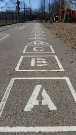 Road marking on walkway in playground