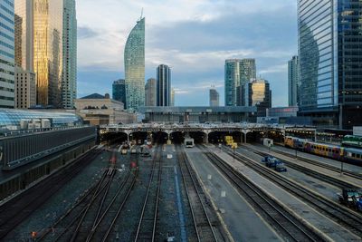 View of railroad tracks and buildings in city