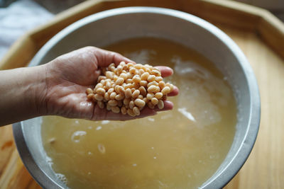 Close-up of person preparing food in bowl