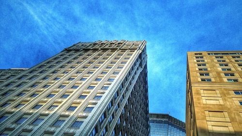 Low angle view of building against blue sky