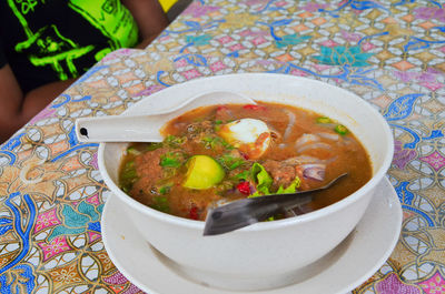 Close-up of soup served on table