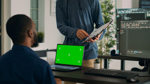 Side view of man working at office