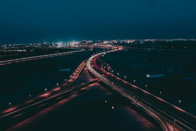 Highway leading to illuminated city