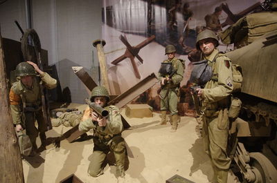 Statues of male army soldiers in museum