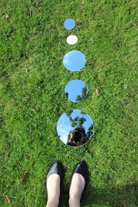 Low section of man standing on golf course