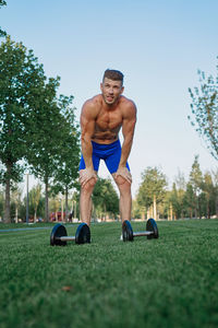 Rear view of man exercising in park