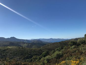 Scenic view of mountains against clear blue sky