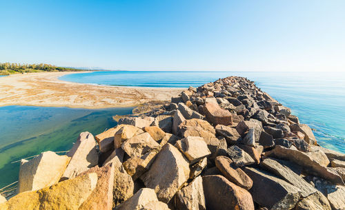 Panoramic view of sea against clear sky