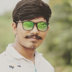 Portrait of young man wearing eyeglasses