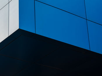 Low angle view of building against clear blue sky