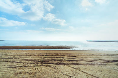 Scenic view of beach against sky