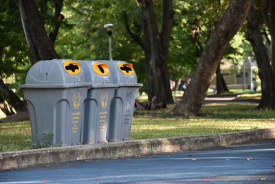 View of empty park bench on street