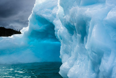 Aerial view of frozen sea against sky