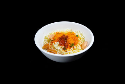 High angle view of food in bowl against black background
