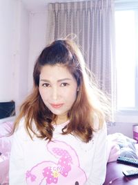 Portrait of beautiful woman at home