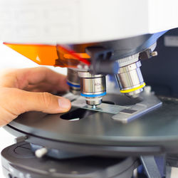 Close-up of person working in machine