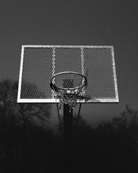 Low angle view of basketball hoop against sky