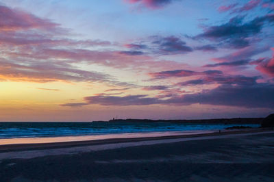 Scenic view of sea against dramatic sky