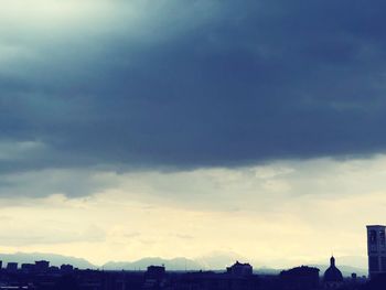 Buildings in city against sky