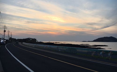 Road against sky during sunset