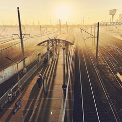 High angle view of railroad tracks at sunset