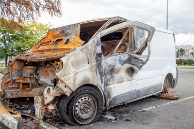 Minibus after a fire, burnt body and interior of the car. burnt rusty car after fire or accident