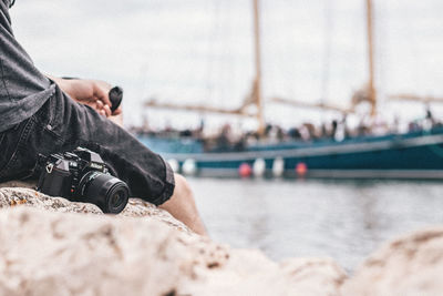 Low section of man on sailboat