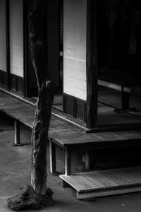 Close-up of sculpture on table by window in building