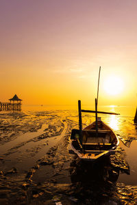 Scenic view of beach against sky during sunset