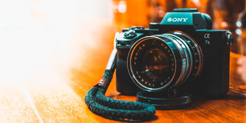 Close-up of camera on table