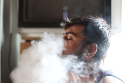 Close-up of man at home