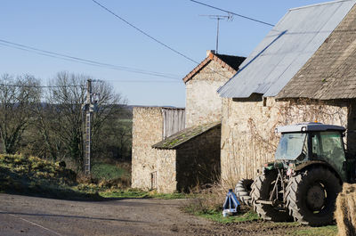Houses on field against sky