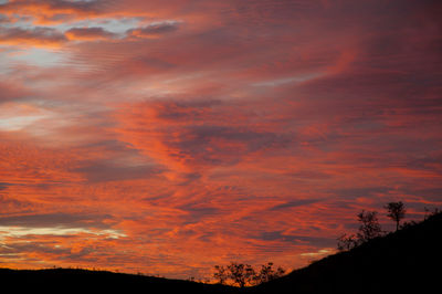 Low angle view of dramatic sky during sunset