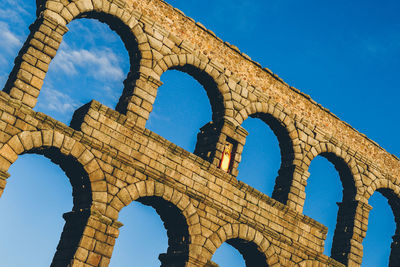 Low angle view of historical building against blue sky