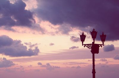 Low angle view of silhouette pole against sky during sunset